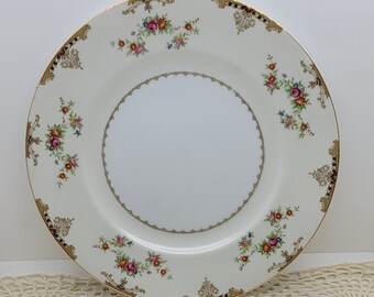 Juego de cuatro platos llanos Meito Ambassador, banda color crema, centro blanco, flores rosas, naranjas y azules, borde tostado y marrón, detalles dorados (2759)