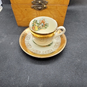 Crest O Gold by Sabin &quot;Courting Couple&quot; Demitasse Tea Cup and Saucer, 22K Warranted Gold Band at Rim of Both Cup and Saucer, 1940&#39;s (2731)