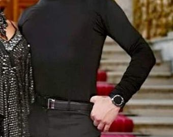 May include: A black long-sleeved mock neck shirt. The shirt is made of a smooth, stretchy fabric.