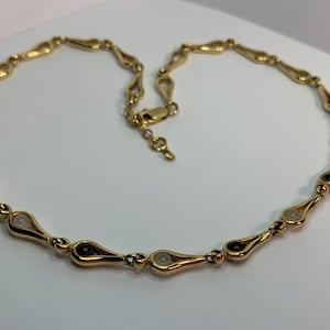 Elegant gold-plated necklace with Charles Jourdan stones.