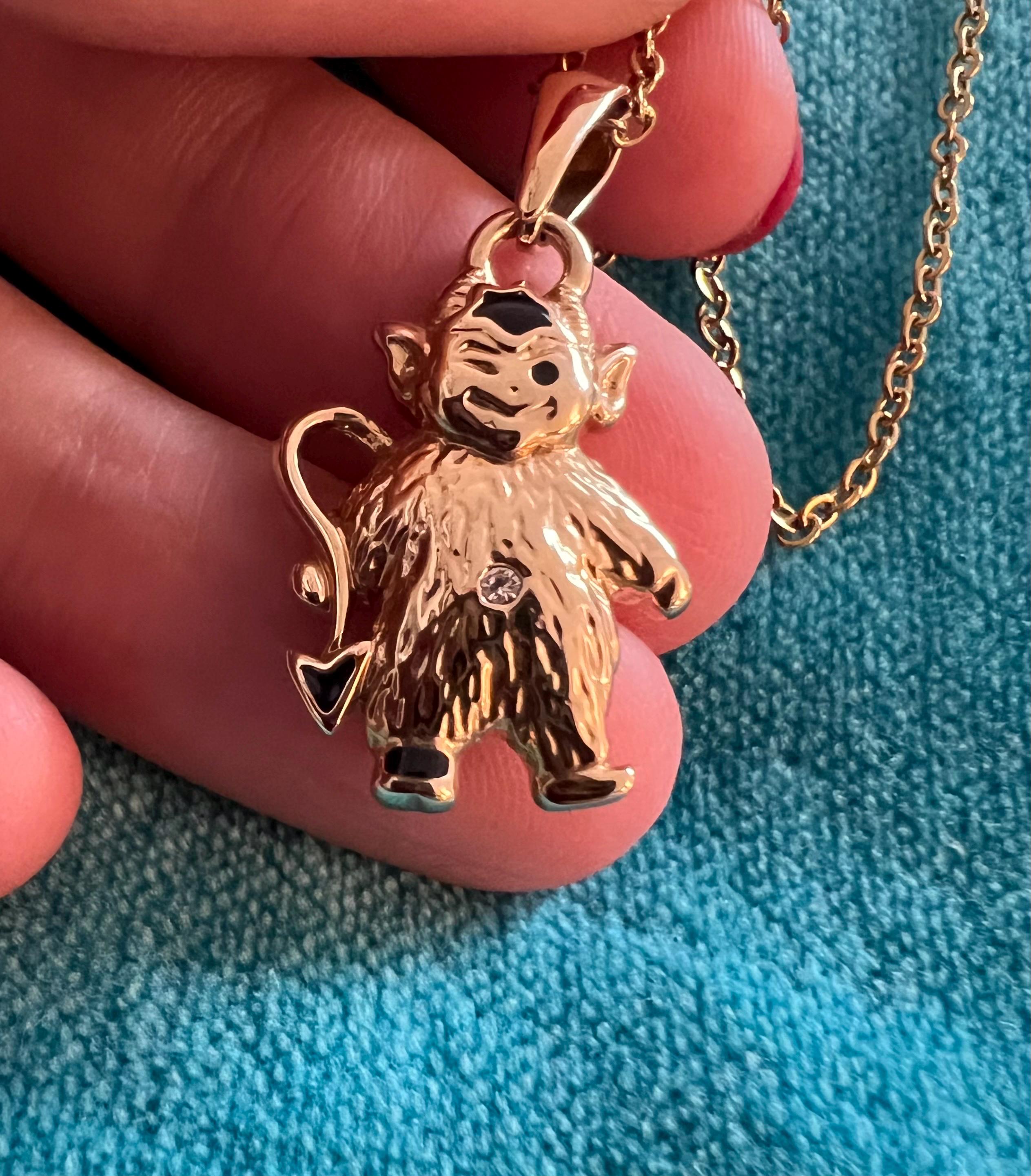 Adorable little monkey pendant in gold plate and black enamel