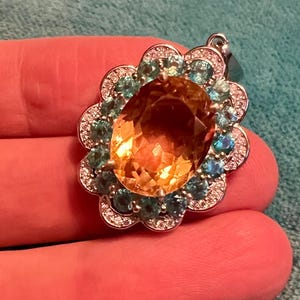 Stunning silver pendant set with citrines and topaz