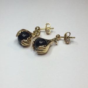 Charles Jourdan hand and onyx earrings