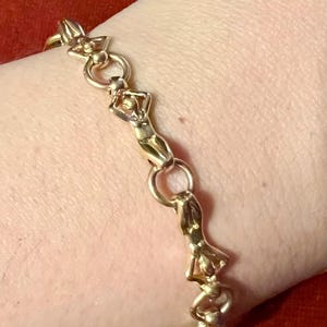 Pretty and original Charles Jourdan gold-plated character bracelet