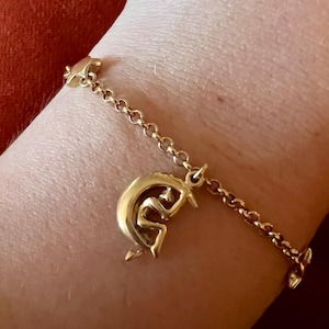 Poetic charm bracelet with muses and crescent moons by Charles Jourdan