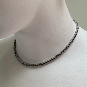 Magnificent silver and black stone river necklace