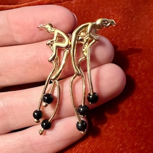 Rare! Magnificent Charles Jourdan muse and onyx pendant earrings