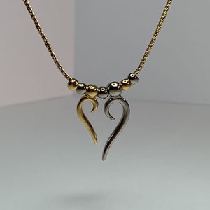 Superb two-tone mobile heart necklace by Charles Jourdan