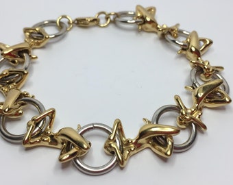 Superb two-tone bracelet with acrobats and hoops by Charles Jourdan