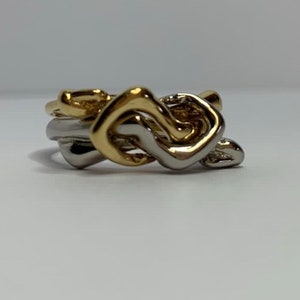 Double two-tone ring Charles Jourdan characters