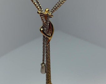 Adorable two-tone hanging character necklace Charles Jourdan