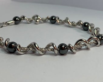 Superb Jourdan bracelet in 925 silver spiral with hematites