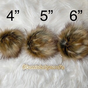 May include: Three faux fur pom poms in brown and beige, measuring 4 inches, 5 inches, and 6 inches in diameter.
