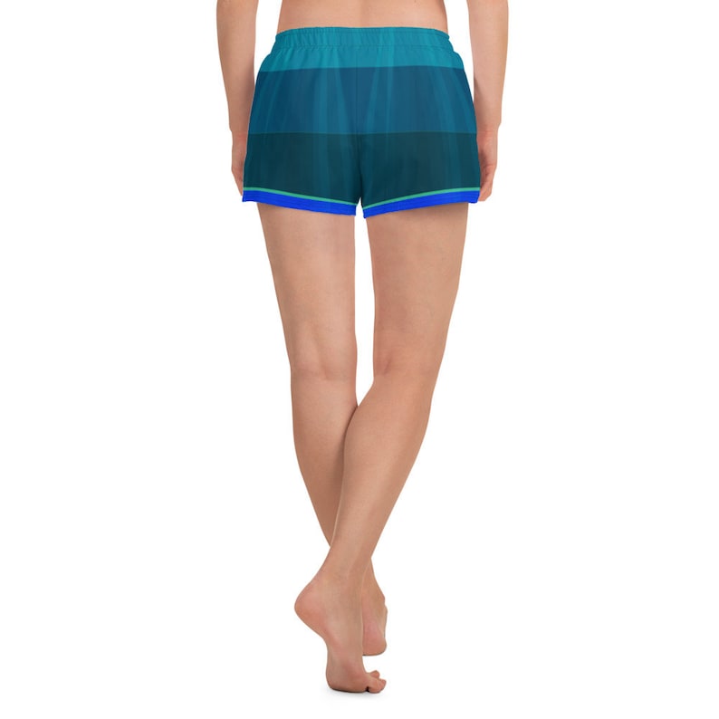 May include: A pair of blue and green athletic shorts with a blue trim. The shorts are made of a lightweight, breathable fabric and are perfect for working out or running errands.