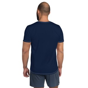 May include: A navy blue short-sleeved t-shirt with a crew neck.