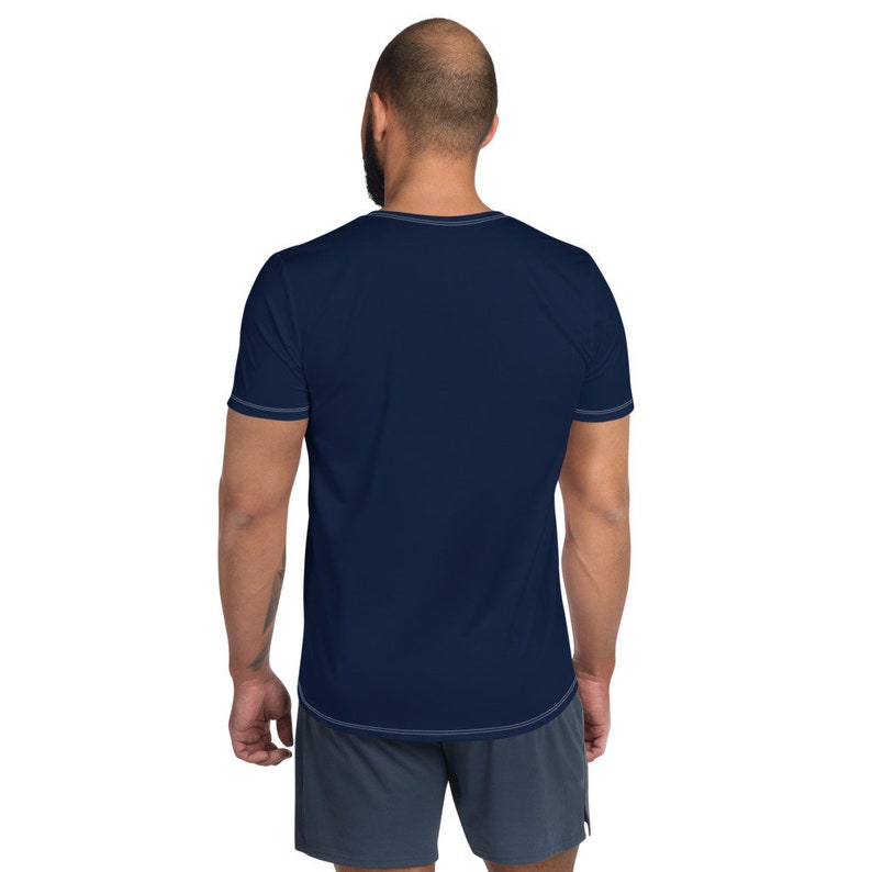 May include: A navy blue short-sleeved t-shirt with a crew neck.