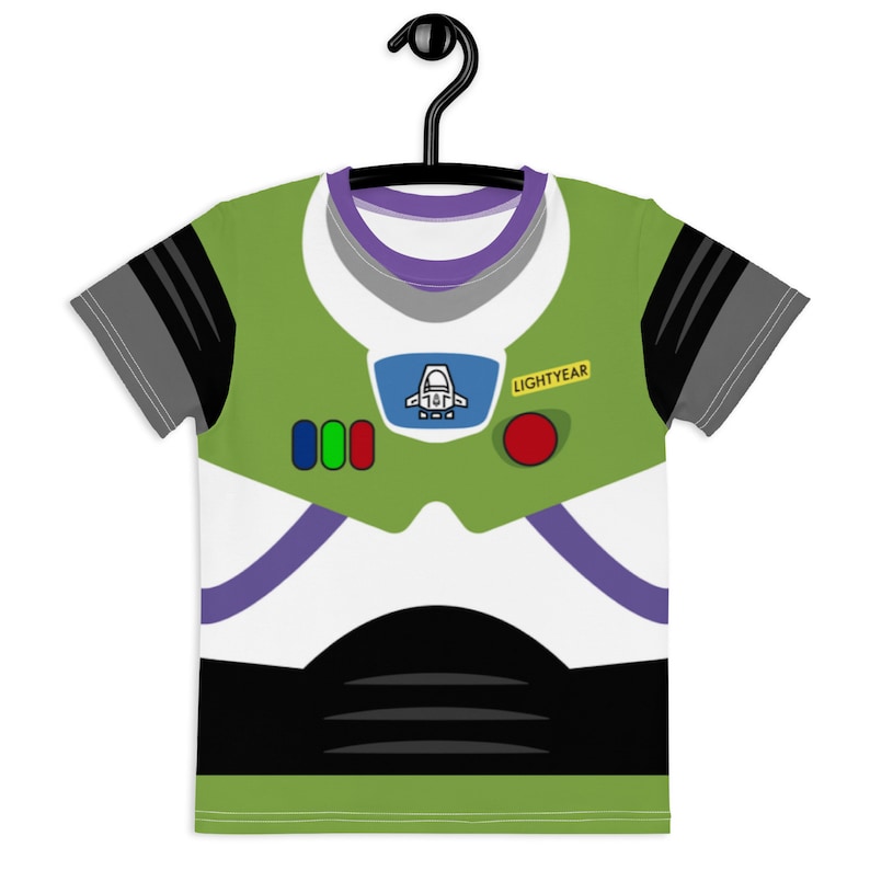 May include: Green, white, and black t-shirt with a cartoon image of Buzz Lightyear from the Toy Story movie franchise. The shirt has a purple collar and a yellow patch that says "LIGHTYEAR".
