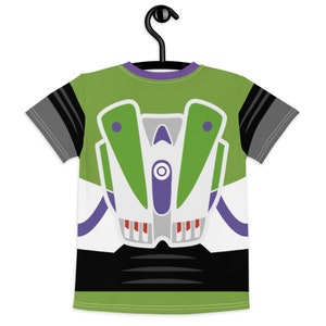 May include: A green, white, purple, and black t-shirt with a cartoon image of Buzz Lightyear from the Toy Story movie franchise.