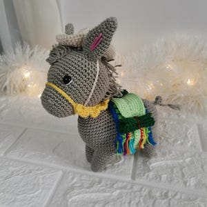Unedited photo of crocheted donkey toy.