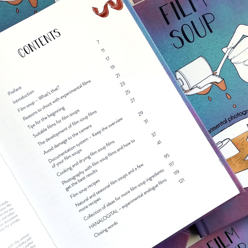 May include: A book titled "Film Soup" with a table of contents listing chapters and page numbers. The book cover features a hand holding a spoon dipping into a can of film soup.