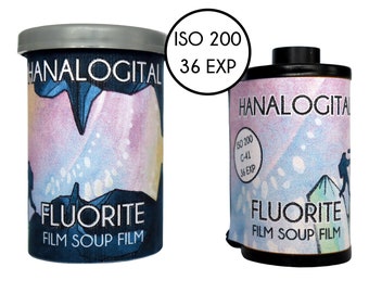 May include: Two canisters of Hanalogital Fluorite film soup film, ISO 200, 36 exposures. The canisters feature a graphic design with dark blue, purple, and white colors, including the text Hanalogital, Fluorite, and Film Soup Film printed on the labels.