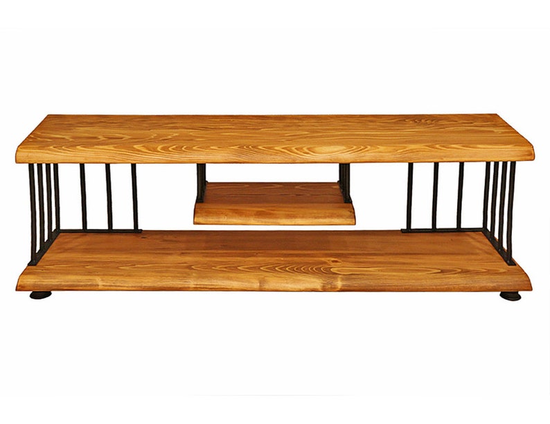 May include: A wooden TV stand with a black metal frame. The stand has two shelves and a natural wood finish.