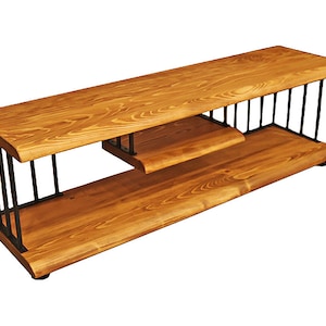 May include: A wooden TV stand with a black metal frame. The stand has two shelves and a curved top.