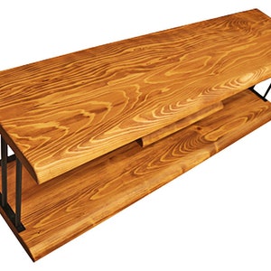 May include: A wooden TV stand with a natural wood finish and black metal legs. The stand has two shelves.