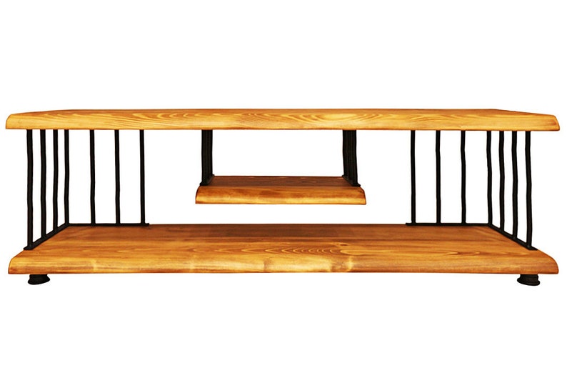 May include: A wooden TV stand with a lower shelf and black metal supports. The stand has a natural wood finish and a simple design.