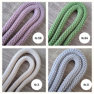 May include: Four spools of braided rope in different colors: dusty rose, green, cream, and light gray. Each spool is labeled with a number: Nr. 59, Nr. 64, Nr. 3, and Nr. 11.