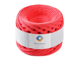 May include: A ball of bright pink t-shirt yarn, made from 100% cotton. The yarn is labeled "Rainbow T-shirt yarn 100% cotton".