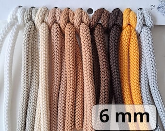 May include: A color chart of 11 different colors of 6 mm thick cord. The colors range from light gray to dark brown and yellow.