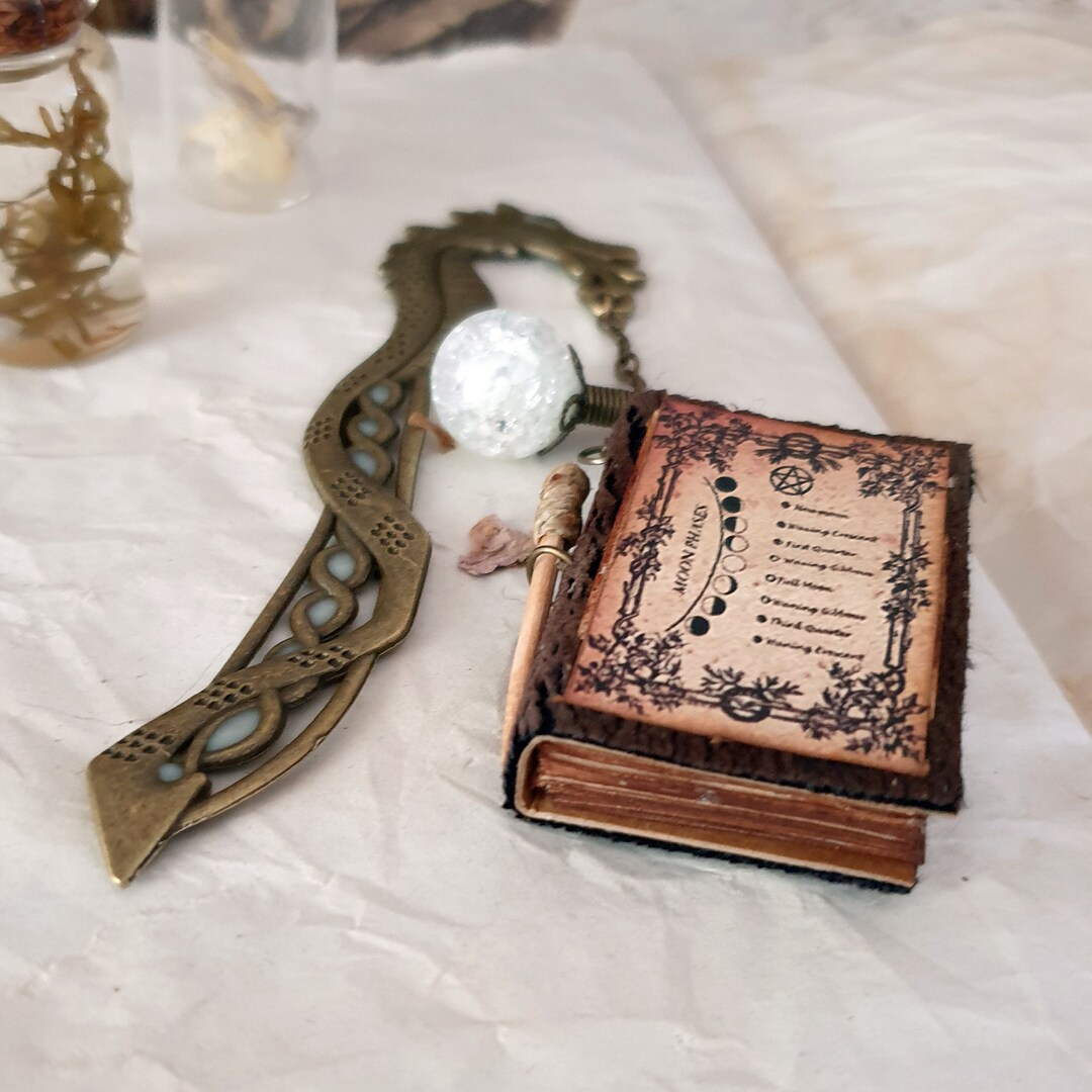 thumbnail image 2 of Glow-in-the-Dark Metal Feather Bookmark - Curious Illuminated Dragon Design 2 of 5