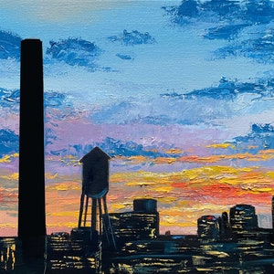 May include: A painting of a city skyline at sunset with a tall chimney and a water tower in the foreground. The sky is a vibrant mix of orange, pink, and blue.