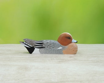 Carved wigeon, wooden sculpture of a bird, duck carving.