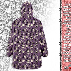 May include: Purple hooded sweatshirt with a repeating pattern of skulls, pumpkins, cats, and other Halloween-themed imagery. The text "ALL OUR PRODUCTS ARE CUSTOM MADE TO ORDER, AND PRODUCTION TIME IS AROUND 2-8 BUSINESS DAYS + SHIPPING TIME. THOUGH USUALLY PRODUCTION AND SHIPMENT ARE ROCKET FAST, FROM TIME TO TIME THERE CAN BE DELAYS DUE TO THE CURRENT WORLDWIDE SITUATION. NEO" is printed on the right side of the image.