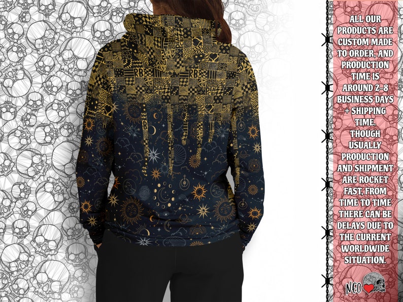 May include: A black hoodie with a gold and white celestial print. The print features stars, moons, and suns. The hoodie has a drawstring hood and a kangaroo pocket.
