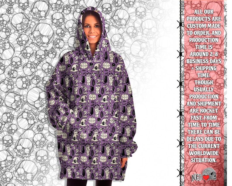 May include: Purple oversized hoodie with a spooky Halloween print featuring skulls, pumpkins, hands, and other spooky elements. The print is repeated all over the hoodie.