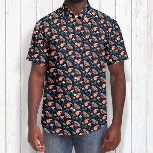May include: A short-sleeved button-down shirt with a dark blue background and a repeating pattern of colorful butterflies and flowers.