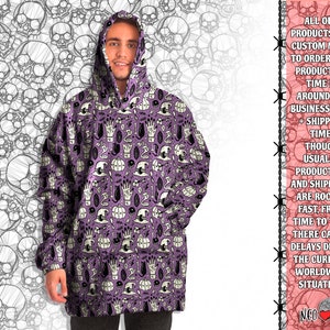 May include: A purple hooded sweatshirt with a repeating pattern of skulls, hands, pumpkins, and other Halloween-themed imagery. The text "ALL OUR PRODUCTS ARE CUSTOM MADE TO ORDER, AND PRODUCTION TIME IS AROUND 2-8 BUSINESS DAYS + SHIPPING TIME. THOUGH USUALLY PRODUCTION AND SHIPMENT ARE ROCKET FAST, FROM TIME TO TIME THERE CAN BE DELAYS DUE TO THE CURRENT WORLDWIDE SITUATION. NEO" is printed on the right side of the image.