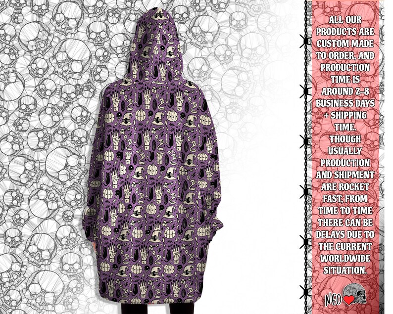 May include: Purple hooded sweatshirt with a repeating pattern of white skulls, pumpkins, hands, and other Halloween-themed imagery.