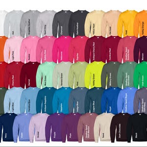 May include: A collection of 50 crewneck sweatshirts in various colors, including red, blue, green, yellow, orange, purple, and black. The sweatshirts are arranged in rows and columns, with each color represented.