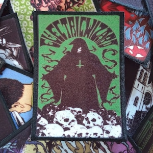 May include: Green and black embroidered patch featuring the text "ELECTRIC WIZARD" in a psychedelic font. A hooded figure with a cross on their chest stands on a pile of skulls.