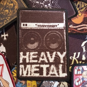 May include: A brown and white embroidered patch with a vintage-style amplifier and the text "Heavy Metal".