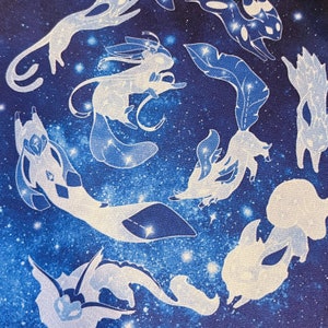 May include: A blue fabric with white outlines of various celestial creatures, including a mermaid, a dragon, and a bird. The fabric has a starry night sky pattern.