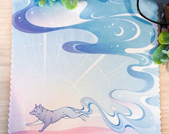May include: A blue and pink microfiber cleaning cloth with a white fox running through a starry sky with a crescent moon. The cloth has a scalloped edge.