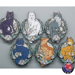 May include: Six enamel pins featuring different colored wolves with a moon and flower design. The wolves are purple, white, gray, blue, orange, and yellow.