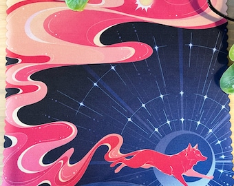 May include: A pink and blue patterned microfiber cleaning cloth with a red fox running through a starry night sky. The fox is running towards a bright sun.