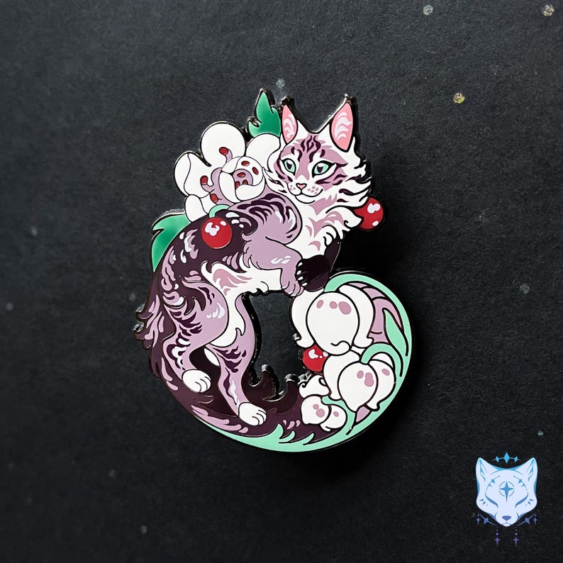 May include: A purple and white cat with green eyes is curled up in a circle of white flowers with red berries. The cat is surrounded by green leaves and vines. The background is a dark gray.
