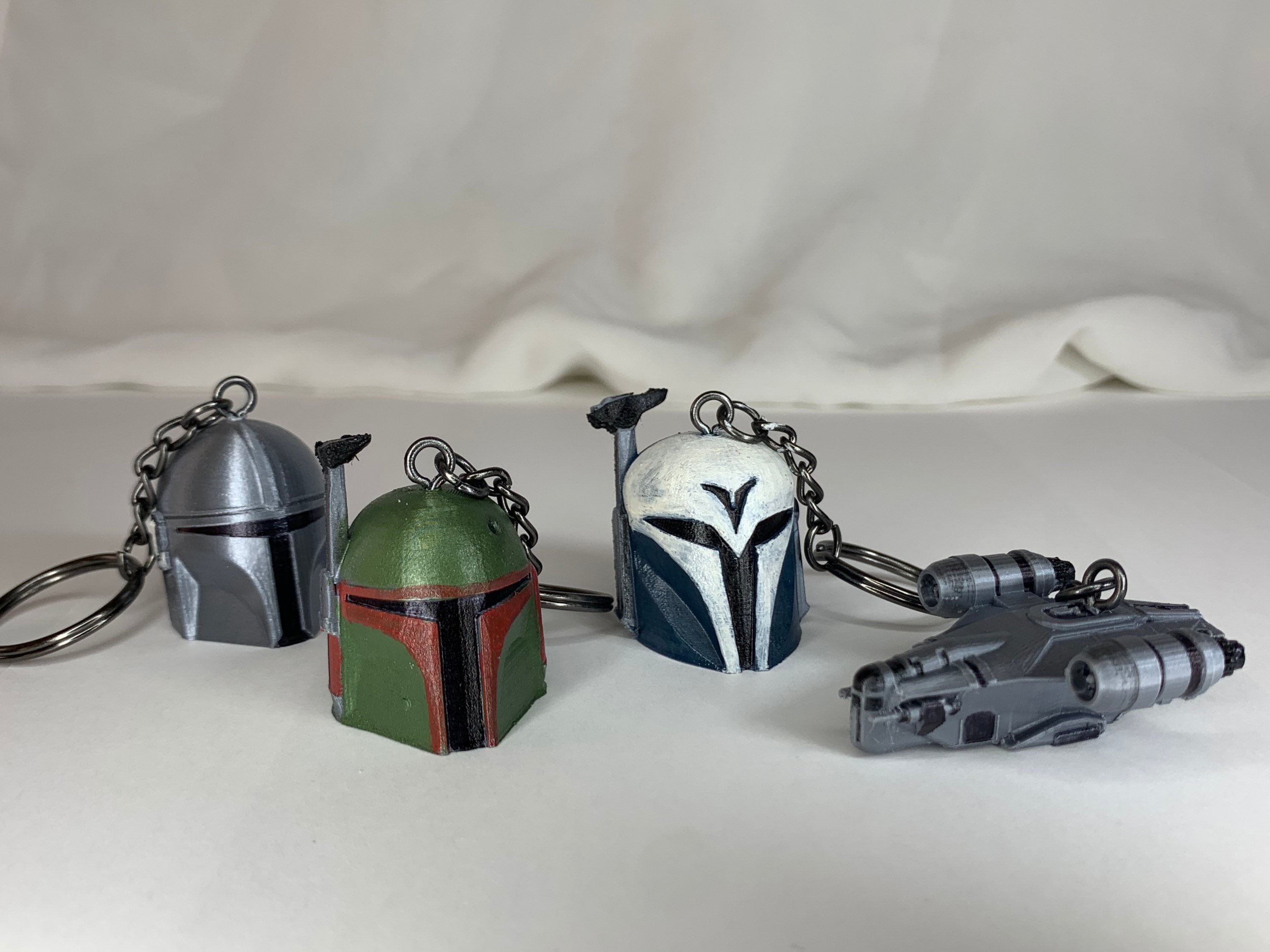 Keychain Set-(4 pieces) Bounty Hunter Mandalorian Helmets(3) and Spac…